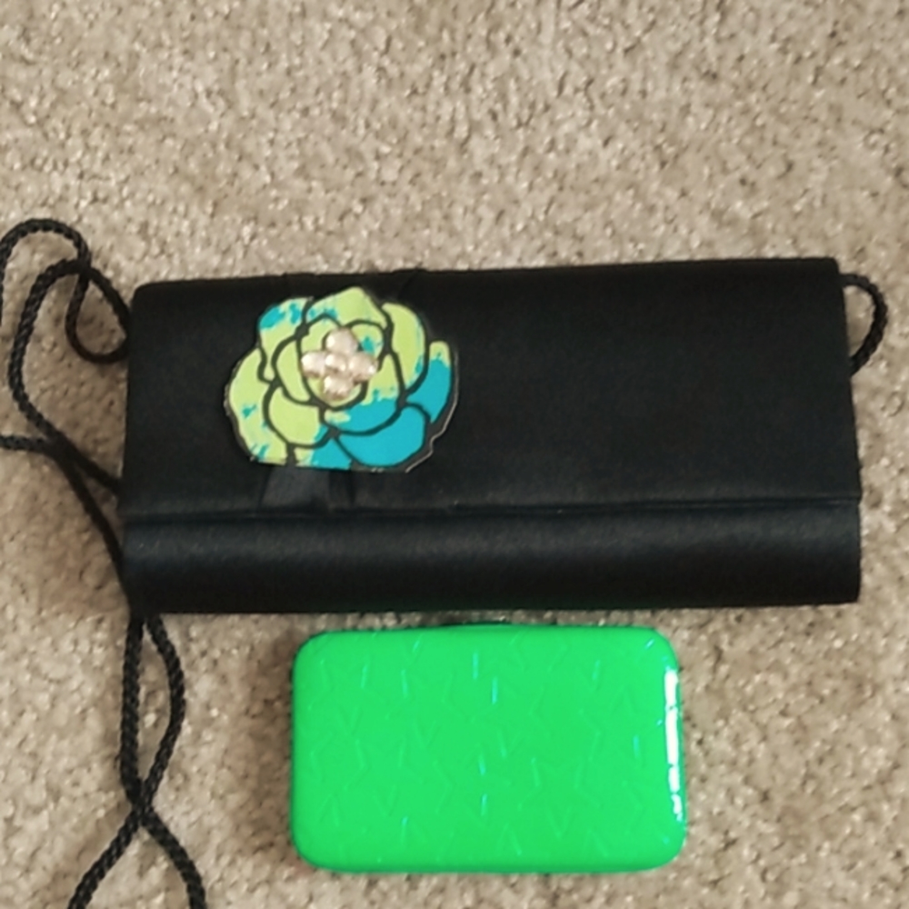 A handbag purse with a strap with a lime green wallet